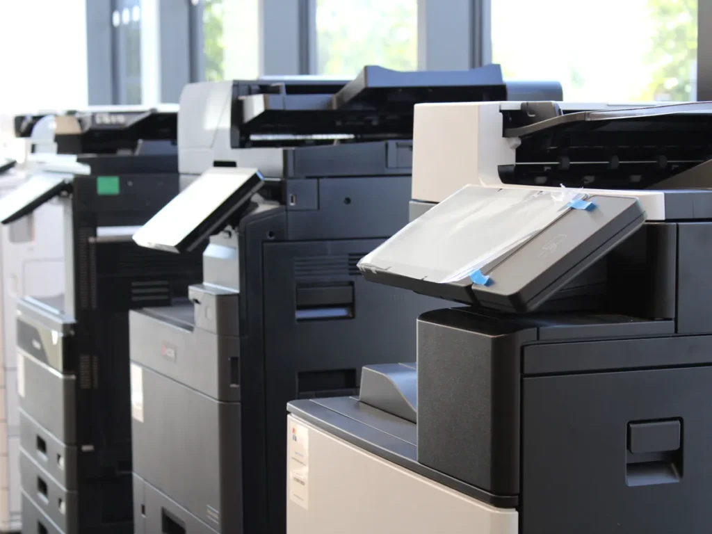 A row of multifunction printers in the Insight Systems showroom